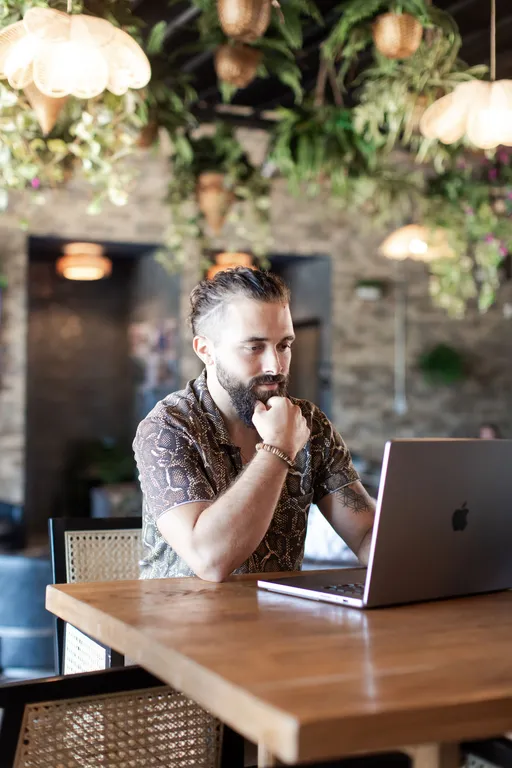Bill Widmer working on a laptop